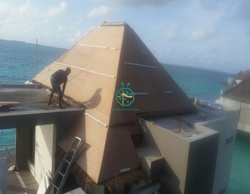 Install plywood on the natural kadjan thatch roof